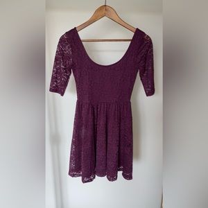 Three quarter length purple lace dress